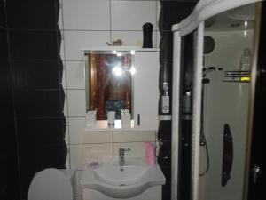 a bathroom with a sink and a mirror at Centar Starog Grada in Kotor