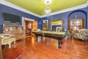 a living room with a pool table and a tv at Lakehurst Estate in Cobourg