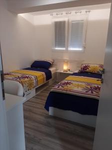 Katil atau katil-katil dalam bilik di H&F apartmani