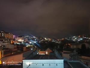 a view of a city at night at The Blue House in Da Lat