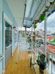 a balcony with a view of a city at The Blue House in Da Lat