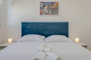 Postel nebo postele na pokoji v ubytování LORI APARTMENT