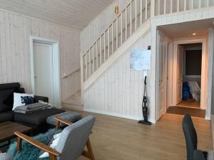 a living room with a couch and a table at Holiday home in beautiful Sjusjøen, near Lillehammer in Ringsaker