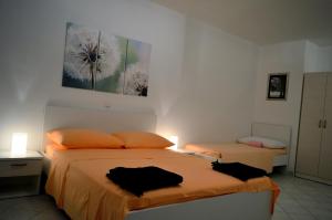 Postel nebo postele na pokoji v ubytování Permarinus Apartments