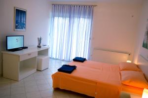 Postel nebo postele na pokoji v ubytování Permarinus Apartments