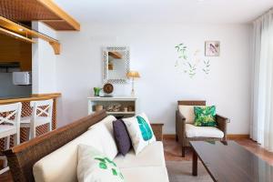 a living room with a couch and a table at The Paradise suites by ANNE, Cozy apartment in Adeje in Adeje