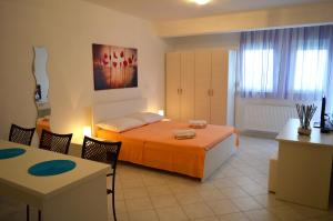 Postel nebo postele na pokoji v ubytování Permarinus Apartments