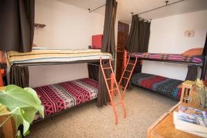 Postel nebo postele na pokoji v ubytování 13 Cielos Hostel & Coworking