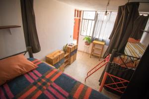 Postel nebo postele na pokoji v ubytování 13 Cielos Hostel & Coworking