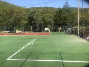a tennis court with two tennis courts at Villa La Moretta in Peschici