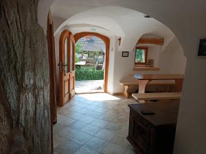 a hallway with an open door to a room with a table at Pr Močnk in Bled