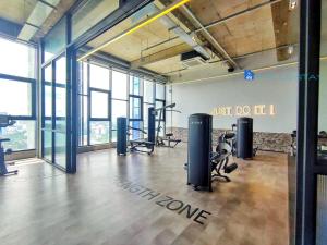 a gym with treadmills and exercise equipment in a room at Millerz Square by A Plus Stay in Kuala Lumpur