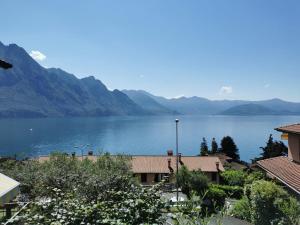 a view of a large body of water with mountains at Appartamento Gelsomino in Riva di Solto