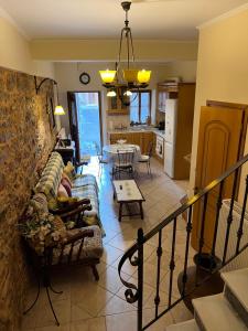 a living room with a couch and a table at Pyrgos Traditional House in Pyrgi