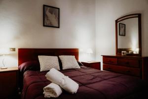 En eller flere senge i et værelse på Casa El Guincho, Garachico