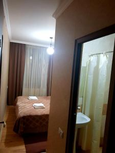 Кровать или кровати в номере Guest House on V. Pshavela 50