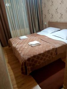 Postel nebo postele na pokoji v ubytování Guest House on V. Pshavela 50