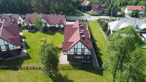 an aerial view of a residential neighborhood with houses at Ostoja Rydzewo A in Rydzewo