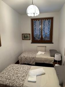 Tempat tidur dalam kamar di Casa Maria (posto auto gratuito)
