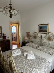 Ένα ή περισσότερα κρεβάτια σε δωμάτιο στο Casa Maria (posto auto gratuito)