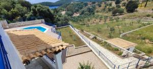 an aerial view of a house with a swimming pool at Villa Rodanthi Sivota in Syvota
