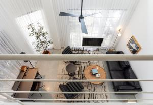an overhead view of a living room with a ceiling at A Bauhaus Gem - Prime Location in Tel Aviv