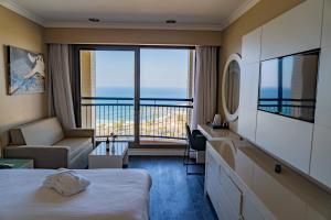 Tamara Ashkelon Hotel客房内的一张或多张床位