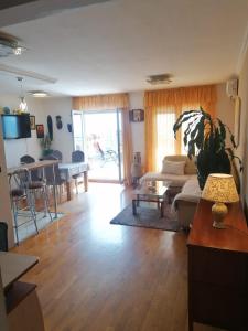 a living room with a couch and a table at Apartments Znjan in Split