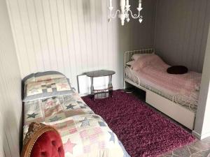 Säng eller sängar i ett rum på Privat soverom med egen inngang