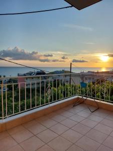 a balcony with a view of the ocean at Sunset Apartments in Kanali