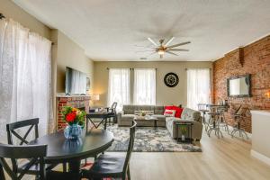 a living room with a couch and a table at St Louis Vacation Rental about 2 Mi to Downtown in Soulard