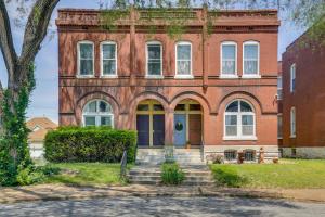 an old red brick building with a blue door at St Louis Vacation Rental about 2 Mi to Downtown in Soulard