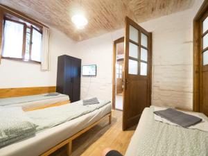 a room with two beds and a window at Central Riverside in Timişoara