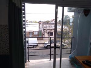 an open window with a view of a street at Complejo TuLuz - Dpto 1 dormitorio con cochera y Monoambiente, con cochera opcional en Tolosa, La Plata, in Tolosa