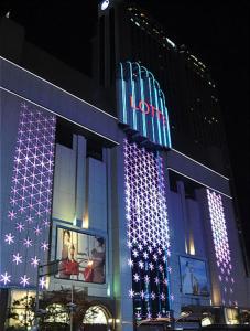 a hotel with christmas lights on the side of a building at HOTEL YUNA Business in Busan