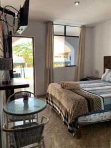 Postel nebo postele na pokoji v ubytování Huacachina Desert House