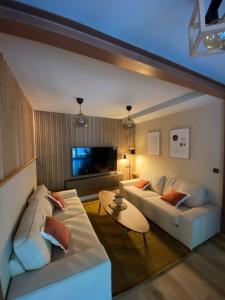 a living room with a couch and a table at Casa Aturuxo in Belesar