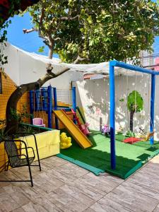 a play area with a playground with a swing at AP1 Atrás da passarela do caranguejo - Orla de Atalaia in Aracaju
