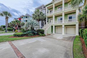 a large house with palm trees and a driveway at Sea Pointe in Hilton Head Island