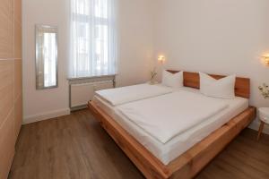 Postel nebo postele na pokoji v ubytování Hotel Germania