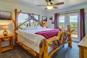 a bedroom with a bed and a balcony at Scenic Arizona Cabin Rental Near Show Low Lake! in Show Low