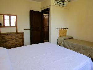 Postel nebo postele na pokoji v ubytování Casina di Desiree e Aurora