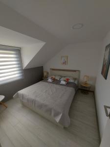 Postel nebo postele na pokoji v ubytování Lučić GUESTHOUSE
