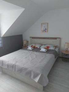 Postel nebo postele na pokoji v ubytování Lučić GUESTHOUSE