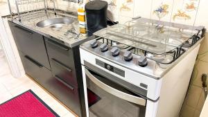 Kuchyň nebo kuchyňský kout v ubytování Vista mar em Caiobá com piscina conforto e localização