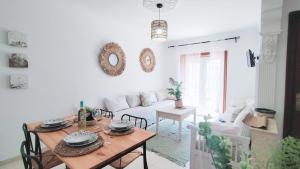 a living room with a table and a couch at La casita in Arona