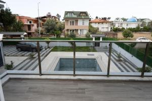 a view from the balcony of a house with a swimming pool at Amore Hotel Teki̇rova in Tekirova