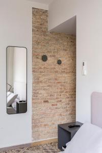 Postel nebo postele na pokoji v ubytování Valentin Suites