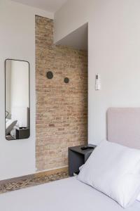 Postel nebo postele na pokoji v ubytování Valentin Suites
