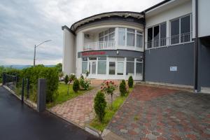 a building with a sign on the side of it at Kašmir in Bugojno